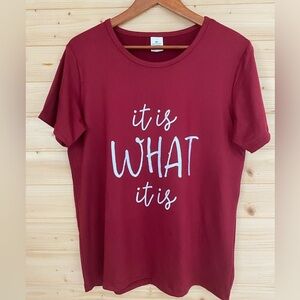 NWOT Burgundy Graphic Print “IT IS WHAT IT IS” Women’s Medium Fun Slogan T-shirt